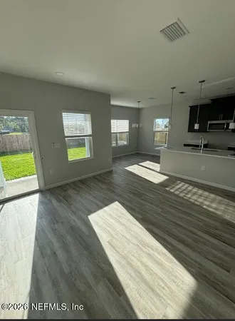 a view of an empty room and window