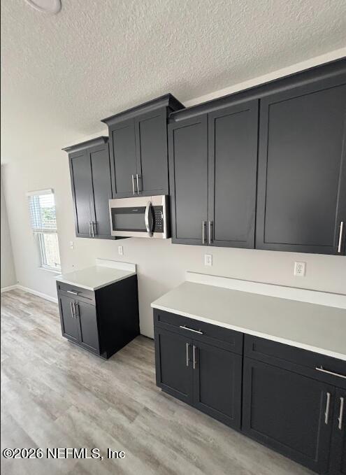 1301 Jewelstone Lane Jacksonville, FL 32221 - Photo 8 of 15 a kitchen with wooden cabinets