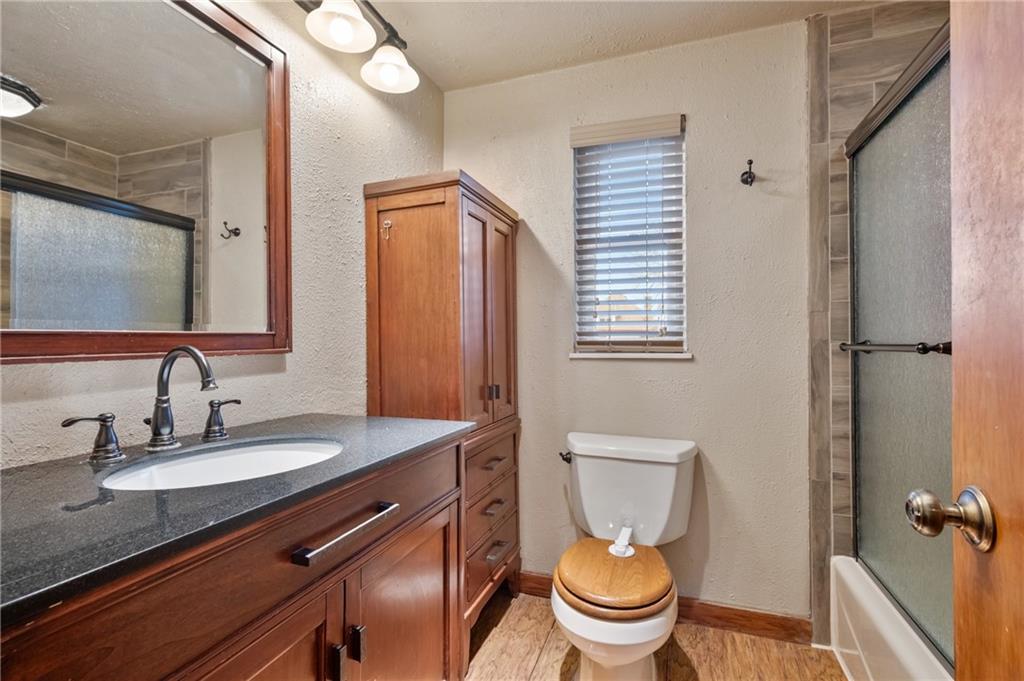 1327 Heberton Street Pittsburgh, PA 15206 - Photo 24 of 40 Upstairs full bath offers a matching vanity and cabinet set. Updated fixtures. Tiled shower and tub combo with sliding privacy glass door.