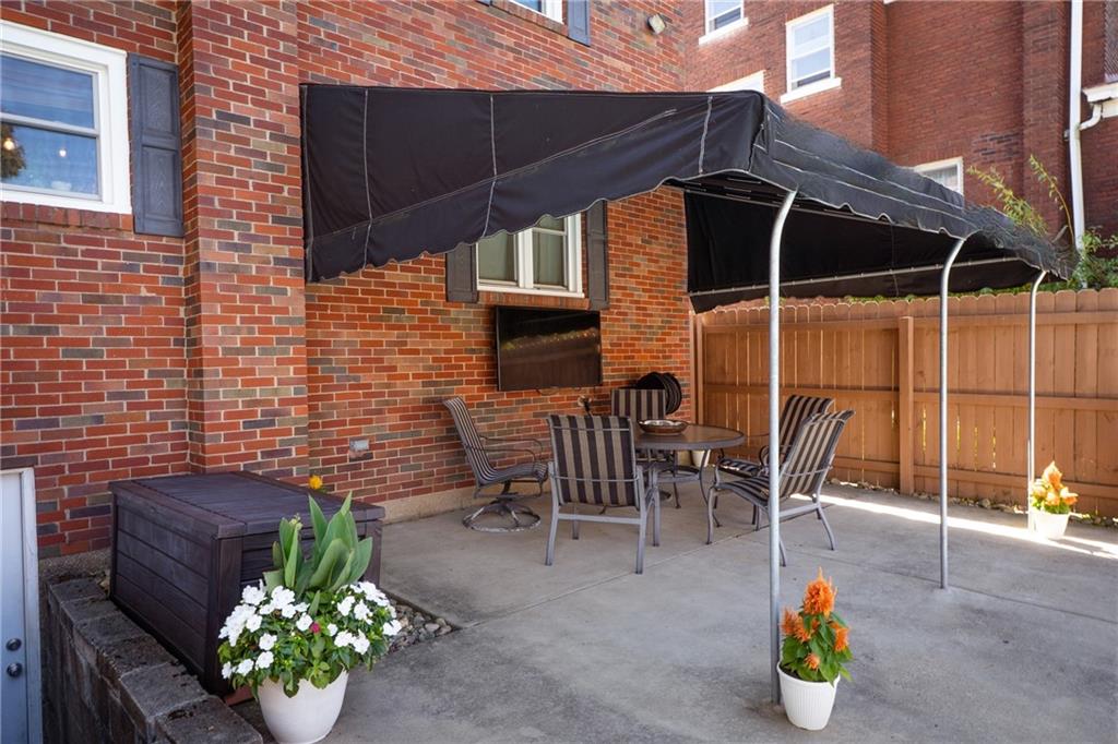 1327 Heberton Street Pittsburgh, PA 15206 - Photo 31 of 40 Mounted tv for outside enjoyment of music and sporting events. Watch from the grilling station located to the left