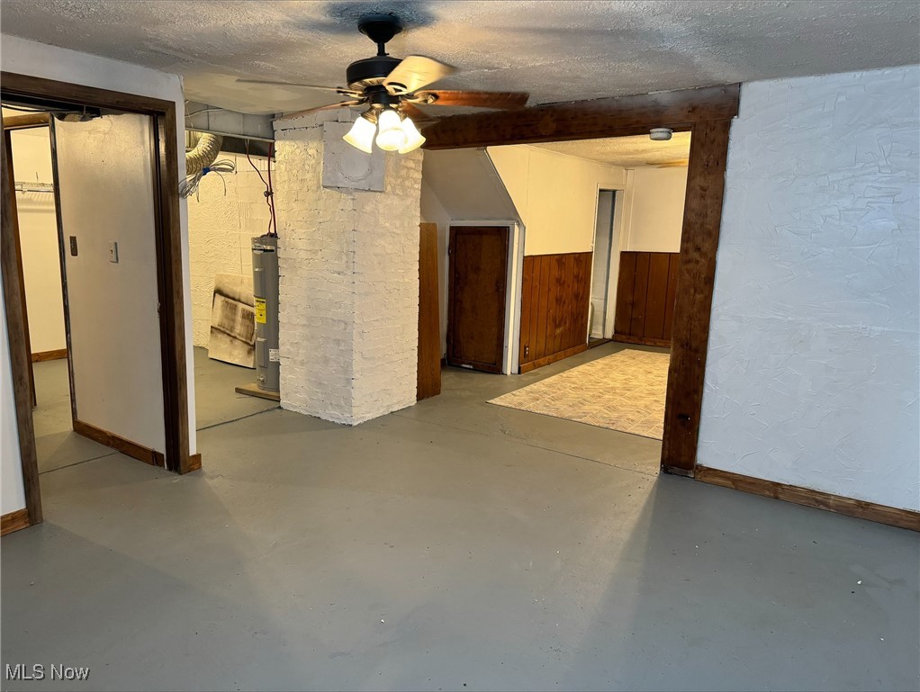 360 Bradys Ridge Road Wellsburg, WV 26070 - Photo 19 of 36 Basement with ceiling fan, a textured ceiling, and electric water heater