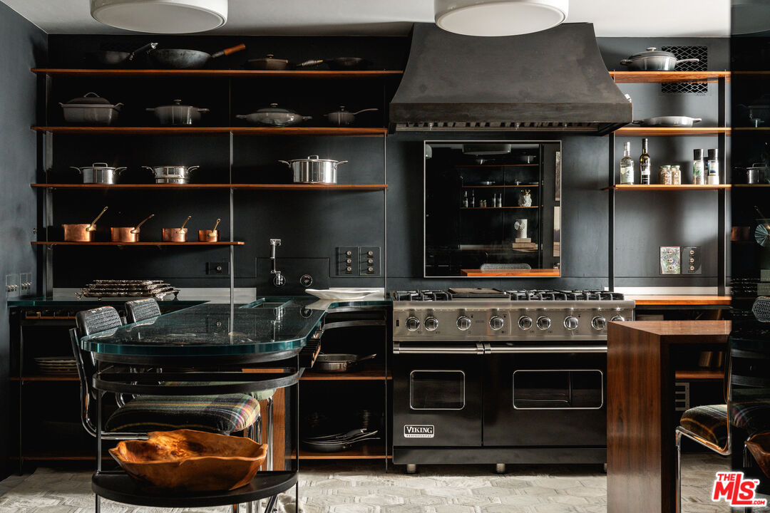 1381 East Valley Road Santa Barbara, CA 93108 - Photo 12 of 28 a kitchen with stainless steel appliances granite countertop a stove and a microwave