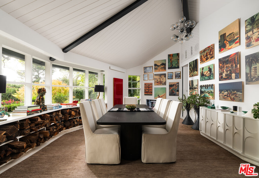 1381 East Valley Road Santa Barbara, CA 93108 - Photo 15 of 28 a dining room with stainless steel appliances furniture large window and wooden floor