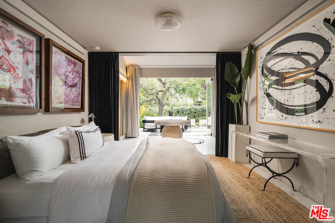 1381 East Valley Road Santa Barbara, CA 93108 - Photo 16 of 28 a bedroom with furniture and a large window