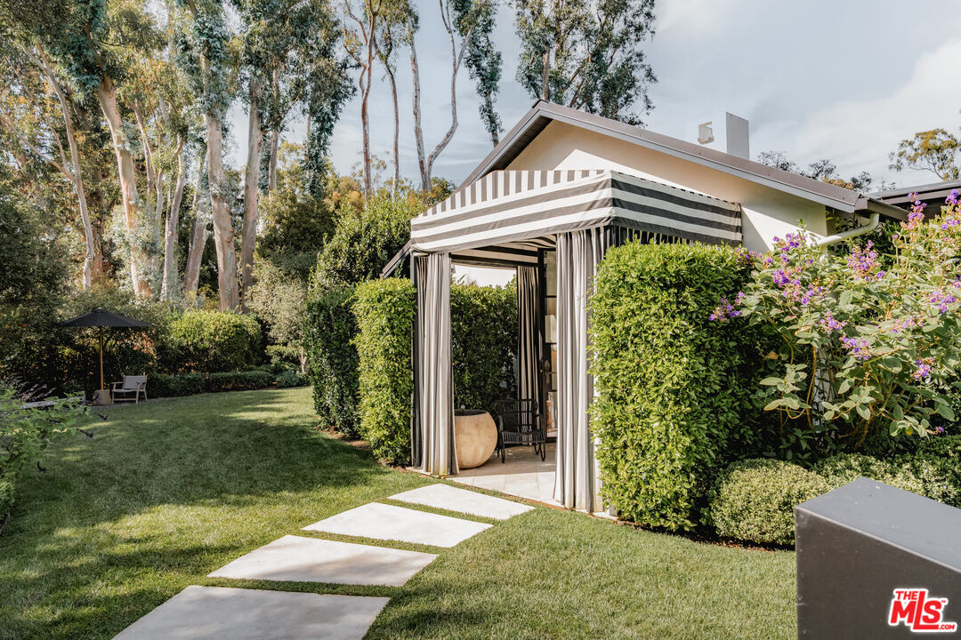 1381 East Valley Road Santa Barbara, CA 93108 - Photo 19 of 28 a front view of a house with a yard