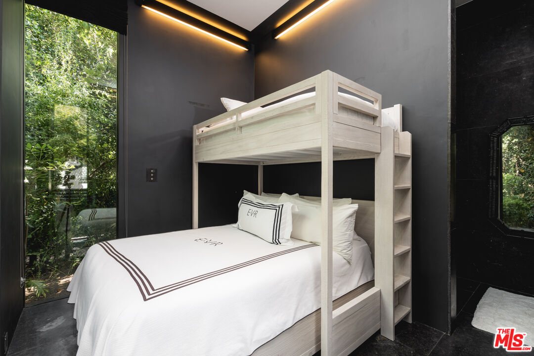 1381 East Valley Road Santa Barbara, CA 93108 - Photo 23 of 28 a bedroom with a bed and a large window