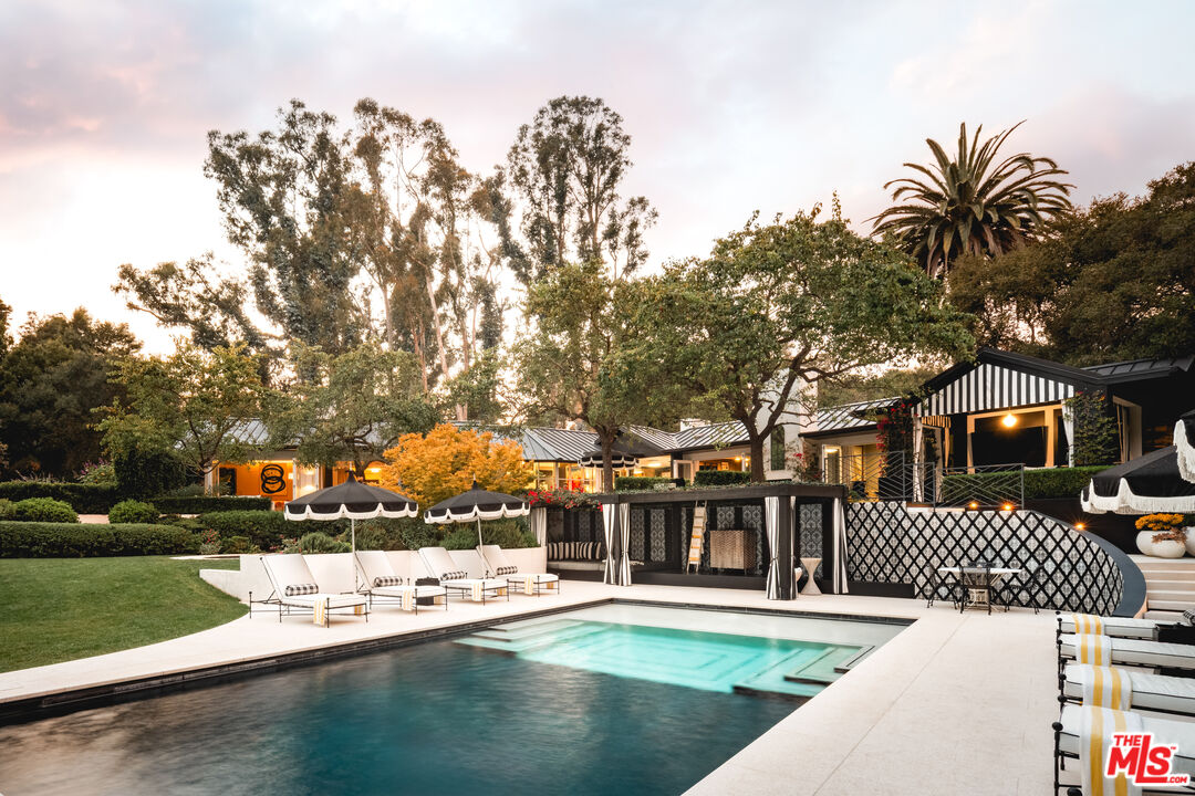 1381 East Valley Road Santa Barbara, CA 93108 - Photo 26 of 28 a front view of a house with a yard and trees