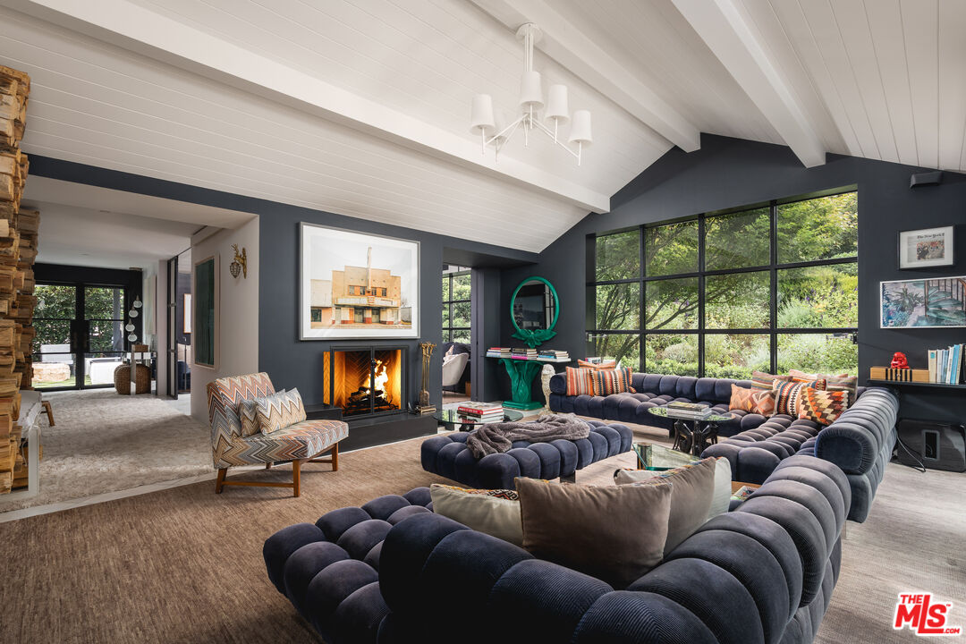 1381 East Valley Road Santa Barbara, CA 93108 - Photo 10 of 28 a living room with furniture a fireplace and a large window