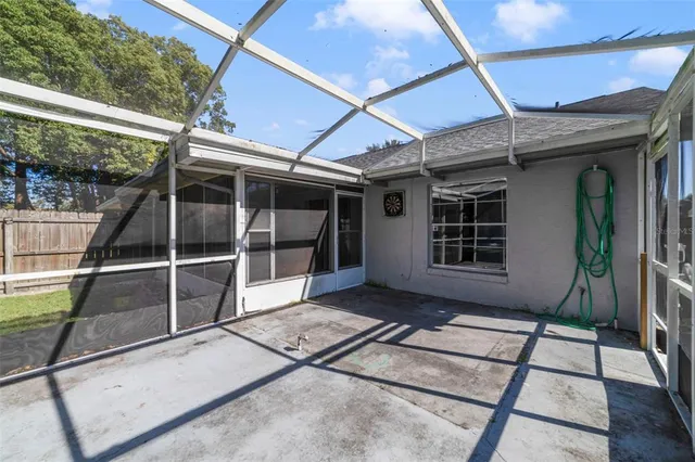 a view of a house with a yard and sitting area