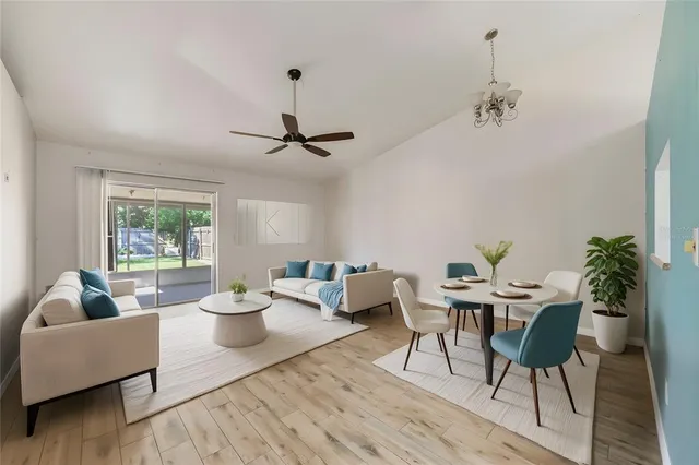 a living room with furniture and a potted plant