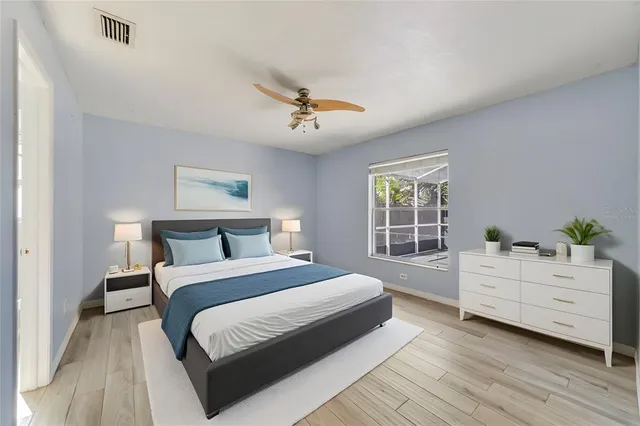 a bedroom with a large bed and a dresser