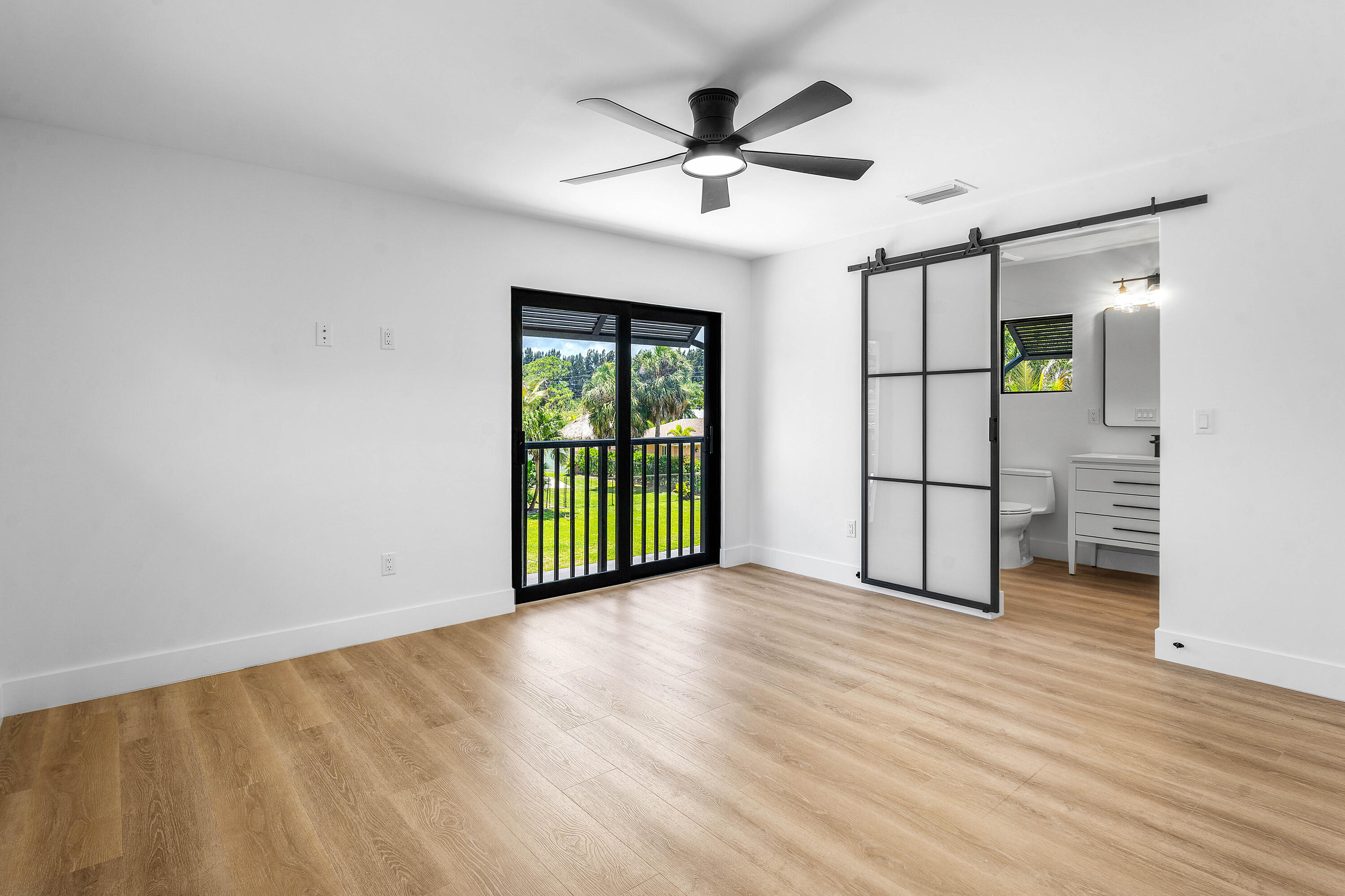 5701 Old Orange Road Jupiter, FL 33458 - Photo 37 of 46 a view of an empty room with a window