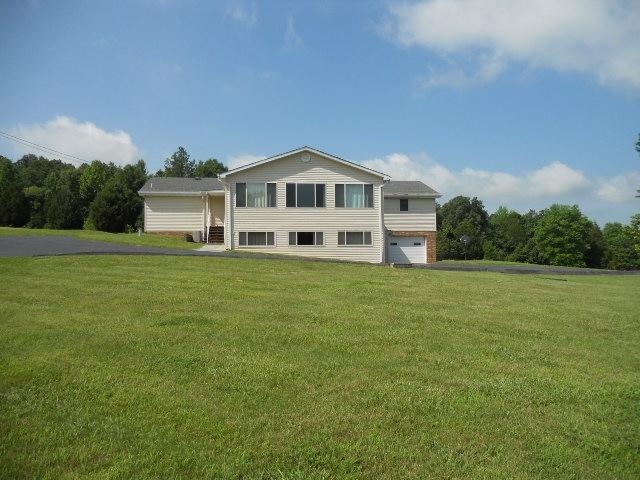 1130 Walnut Grove Road Dickson, TN 37055 - Photo 3 of 17 Back view of home. Upper level is a super nice sunroom or den with storage, lower level has a extra large rec. room.