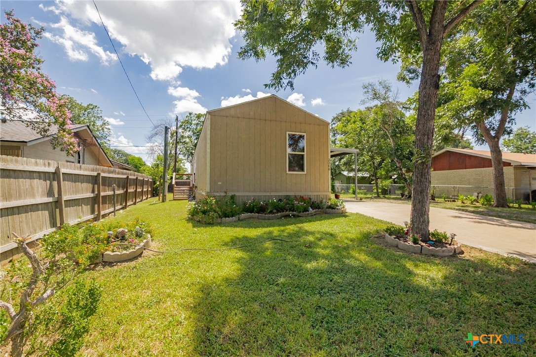 3308 Catalpa Street Victoria, TX 77901 - Photo 1 of 22 a view of backyard with tree