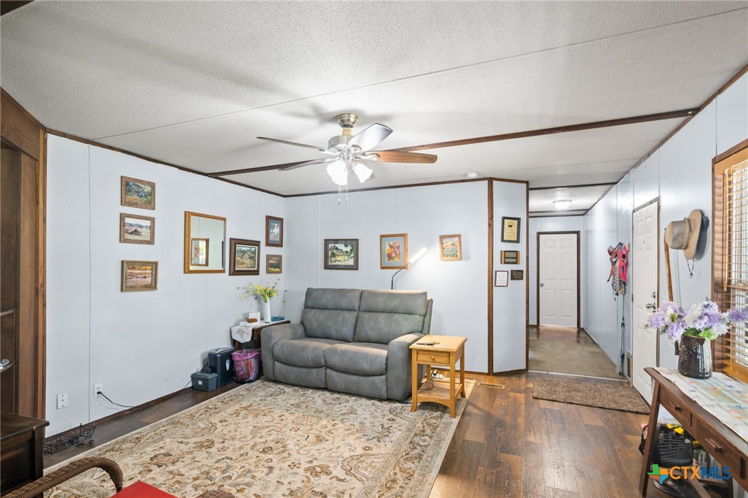 3308 Catalpa Street Victoria, TX 77901 - Photo 14 of 22 a living room with furniture and wooden floor