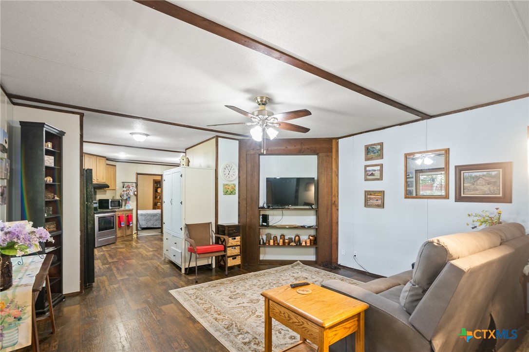 3308 Catalpa Street Victoria, TX 77901 - Photo 15 of 22 a living room with furniture and a flat screen tv