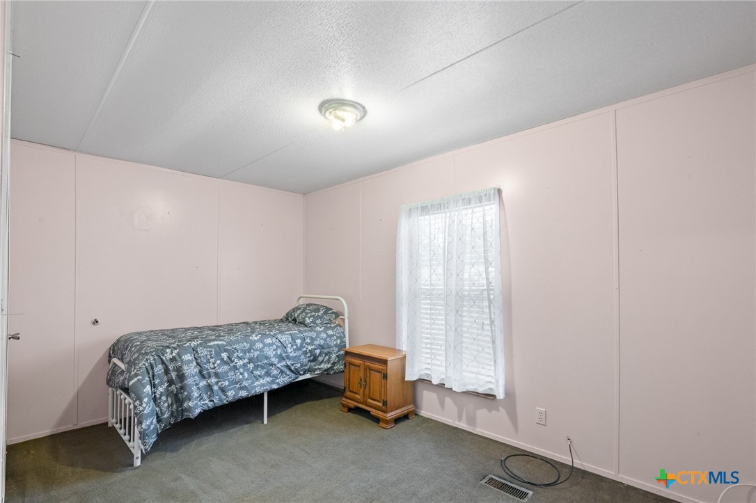 3308 Catalpa Street Victoria, TX 77901 - Photo 18 of 22 a bedroom with a bed and a window