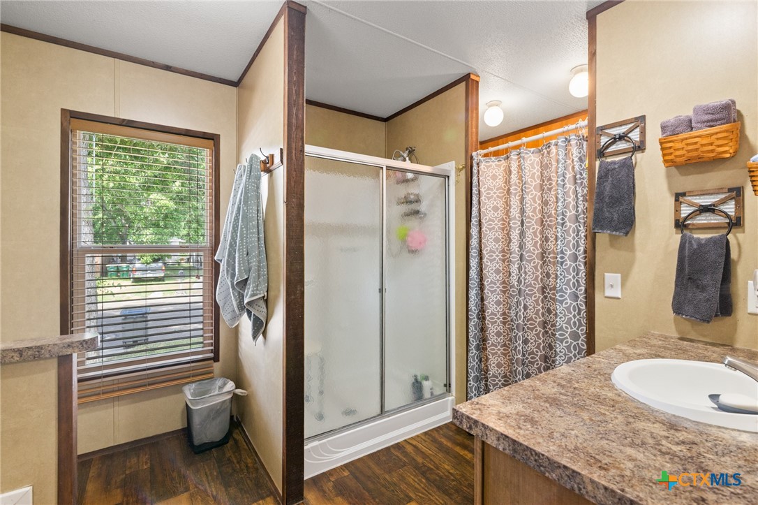 3308 Catalpa Street Victoria, TX 77901 - Photo 20 of 22 a bathroom with a granite countertop sink and a mirror