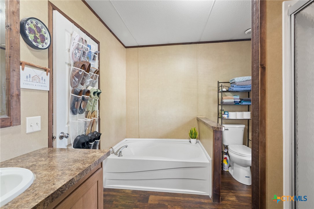 3308 Catalpa Street Victoria, TX 77901 - Photo 21 of 22 a bathroom with a granite countertop sink and a mirror