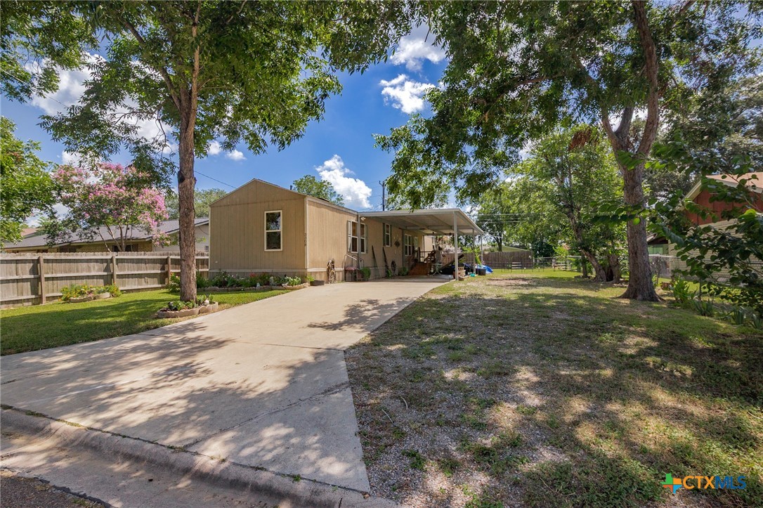 3308 Catalpa Street Victoria, TX 77901 - Photo 3 of 22 a front view of a house with a yard and tree s