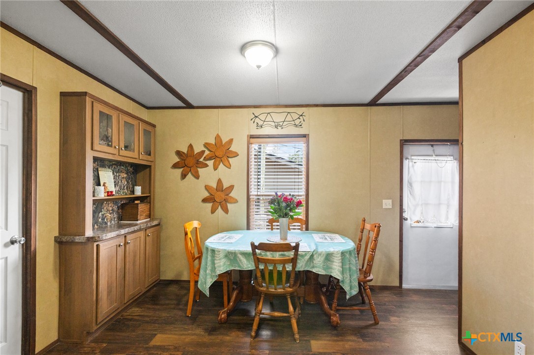 3308 Catalpa Street Victoria, TX 77901 - Photo 8 of 22 a view of a dining room with furniture window and wooden floor