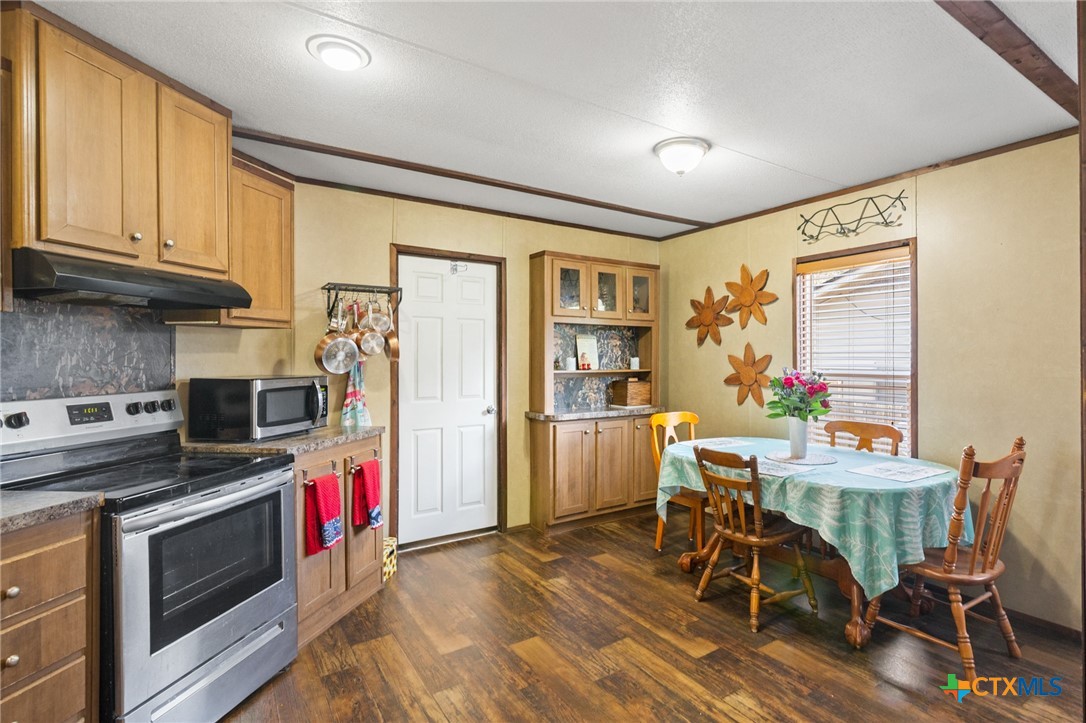 3308 Catalpa Street Victoria, TX 77901 - Photo 9 of 22 a view of a kitchen with furniture and wooden floor