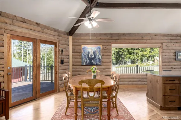 a view of a dining room with furniture window and outside view