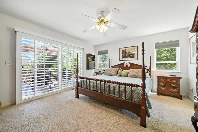 a spacious bathroom with a granite countertop sink and a mirror