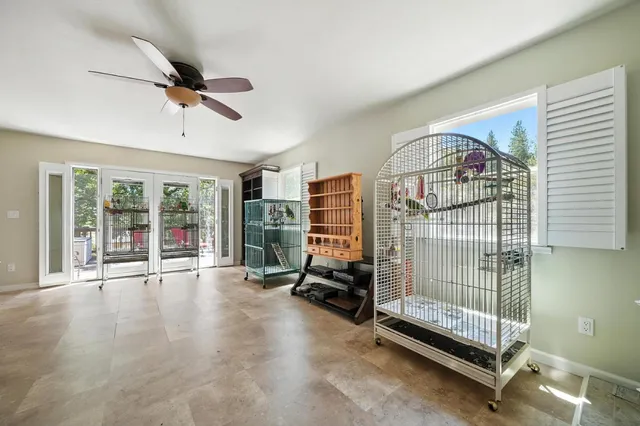 a living room with furniture and a kitchen