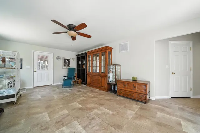 a view of a livingroom with furniture and workspace