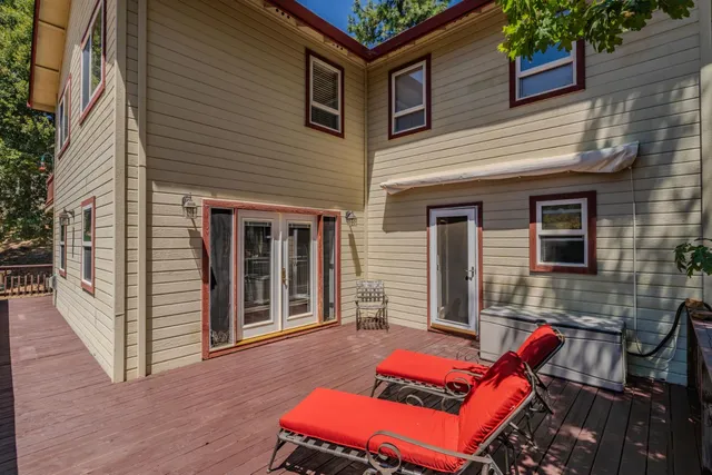 a view of a chairs and table in the patio