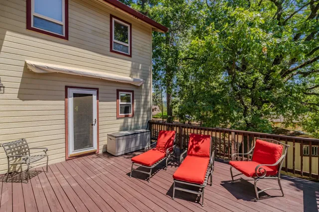 a view of a house with a yard and sitting area