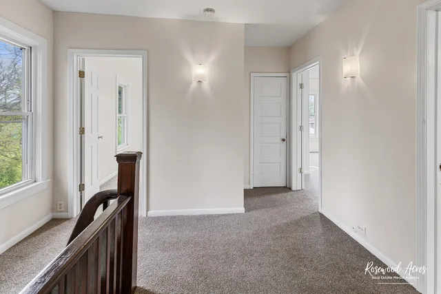 a view of a hallway with a window