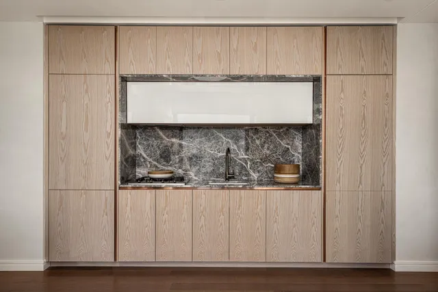 a bathroom with sink mirror and shower