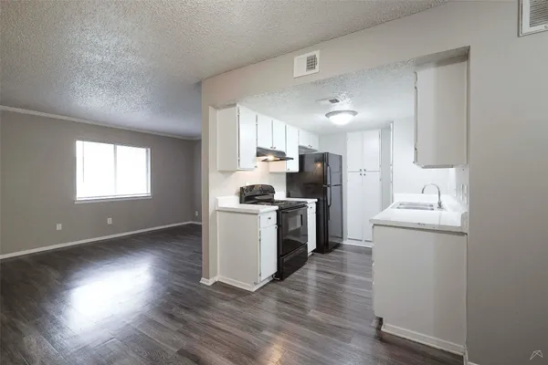 a view of kitchen with wooden floor