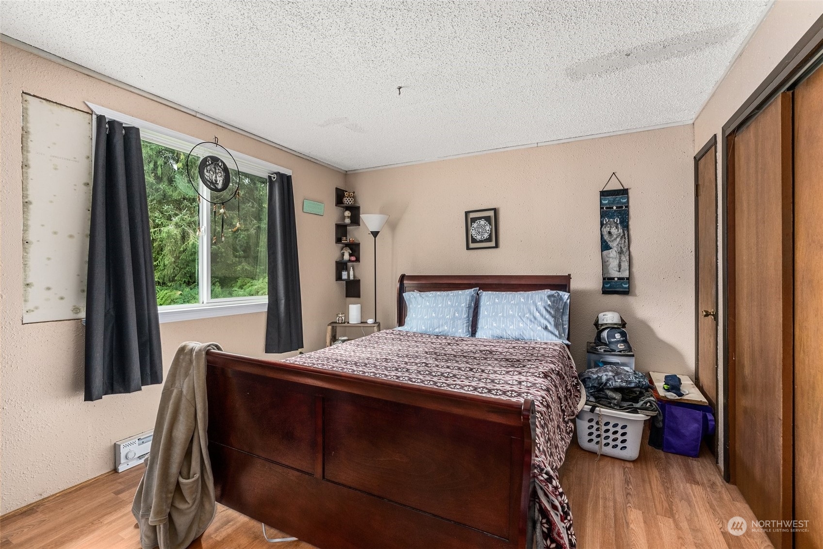 5402 Us Highway Humptulips, WA 98552 - Photo 14 of 17 a bedroom with a bed and wooden floor