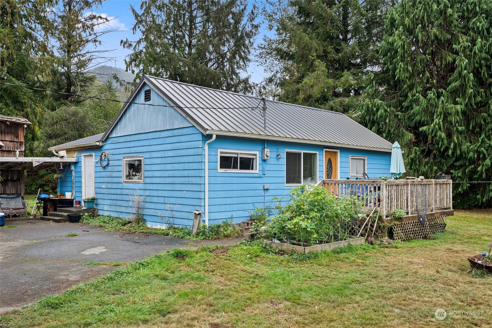 5402 Us Highway Humptulips, WA 98552 - Photo 5 of 17 a view of a house with a yard and sitting area