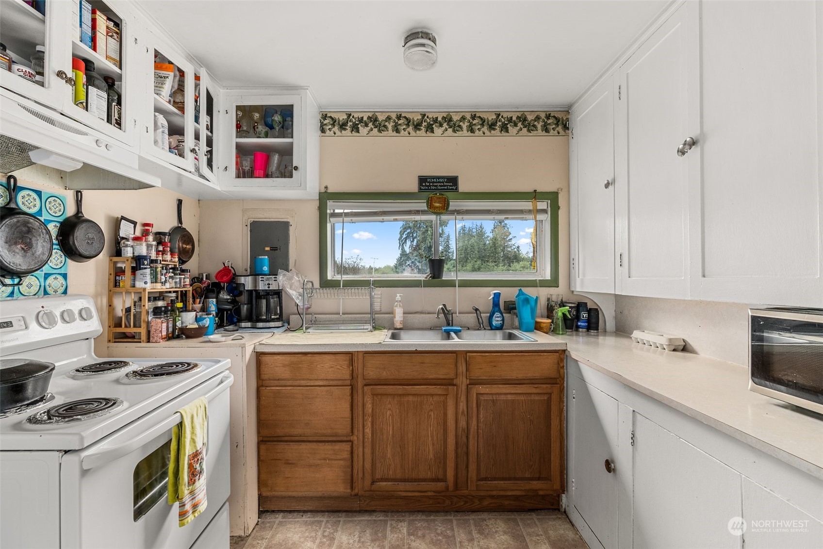 5402 Us Highway Humptulips, WA 98552 - Photo 10 of 17 a kitchen with a sink cabinets and wooden floor