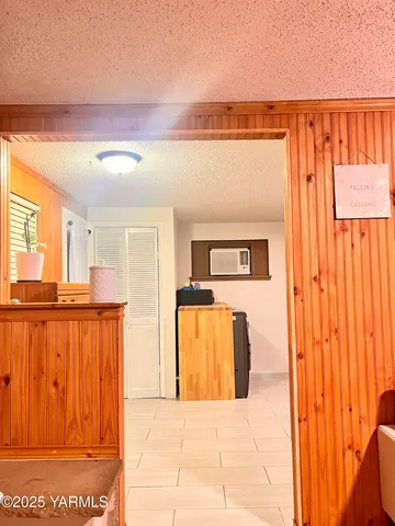 a bedroom with a bed and a night stand