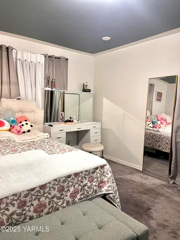 a bedroom with a bed and a walk in closet