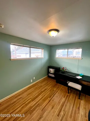 a bed room with furniture and a window