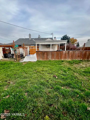 a view of a big yard with a big yard and large trees