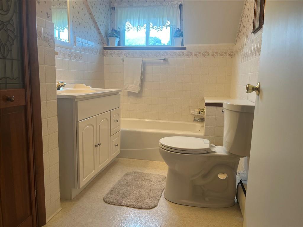 451-457 Joffre Cherry Valley Road Burgettstown, PA 15021 - Photo 12 of 46 a bathroom with a sink toilet and shower