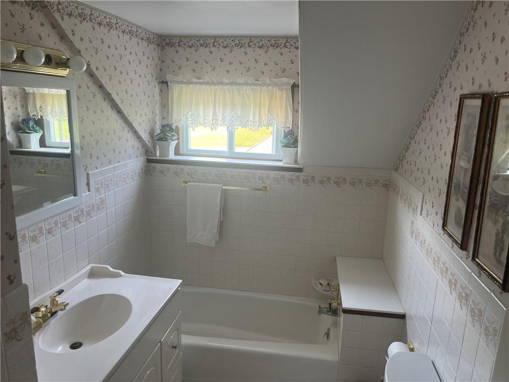 451-457 Joffre Cherry Valley Road Burgettstown, PA 15021 - Photo 13 of 46 a bathroom with a sink toilet and shower