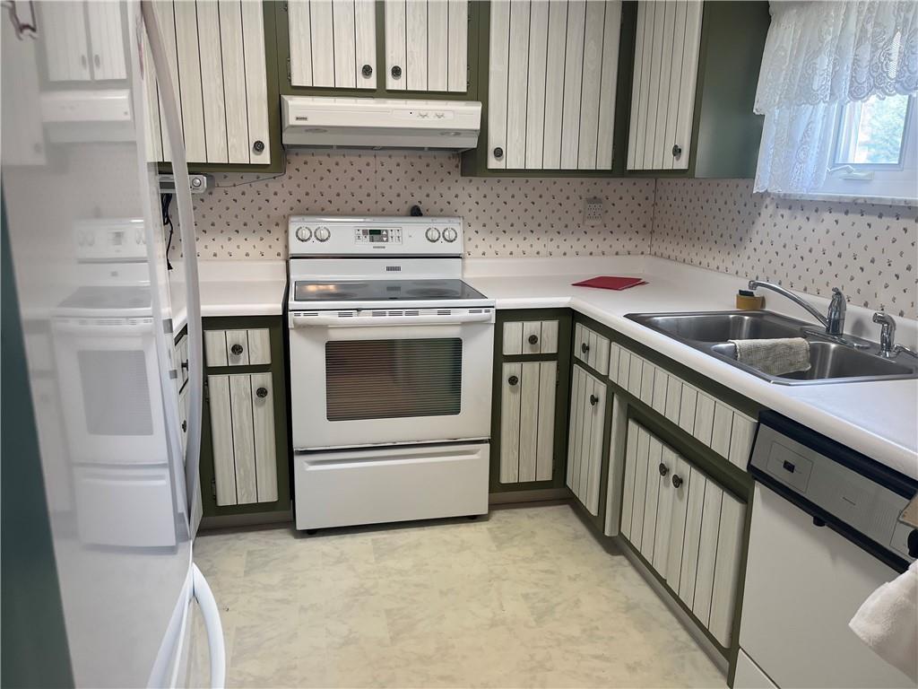 451-457 Joffre Cherry Valley Road Burgettstown, PA 15021 - Photo 22 of 46 a kitchen with granite countertop white cabinets and white appliances