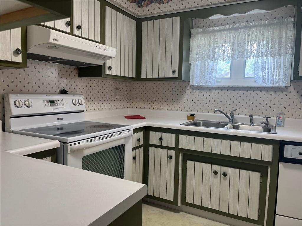 451-457 Joffre Cherry Valley Road Burgettstown, PA 15021 - Photo 23 of 46 a kitchen with stainless steel appliances a stove a sink and cabinets