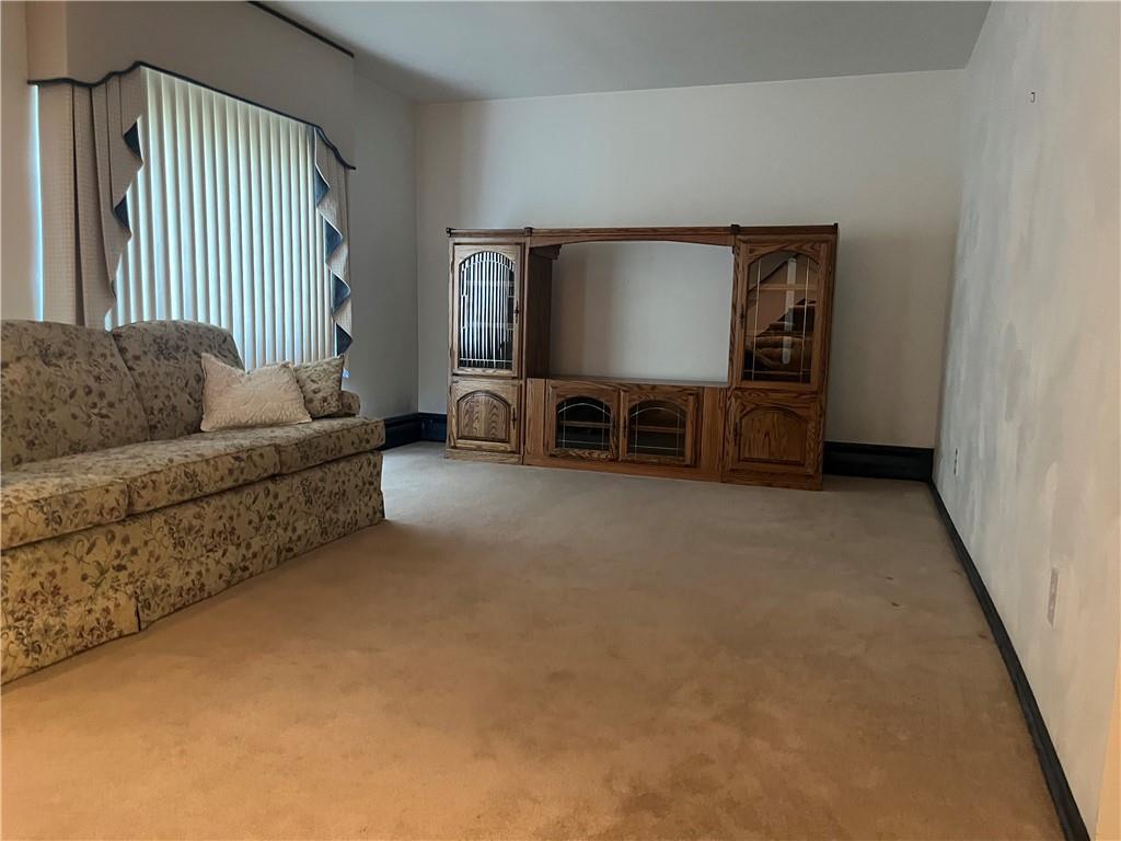 451-457 Joffre Cherry Valley Road Burgettstown, PA 15021 - Photo 26 of 46 a living room with furniture and a flat screen tv