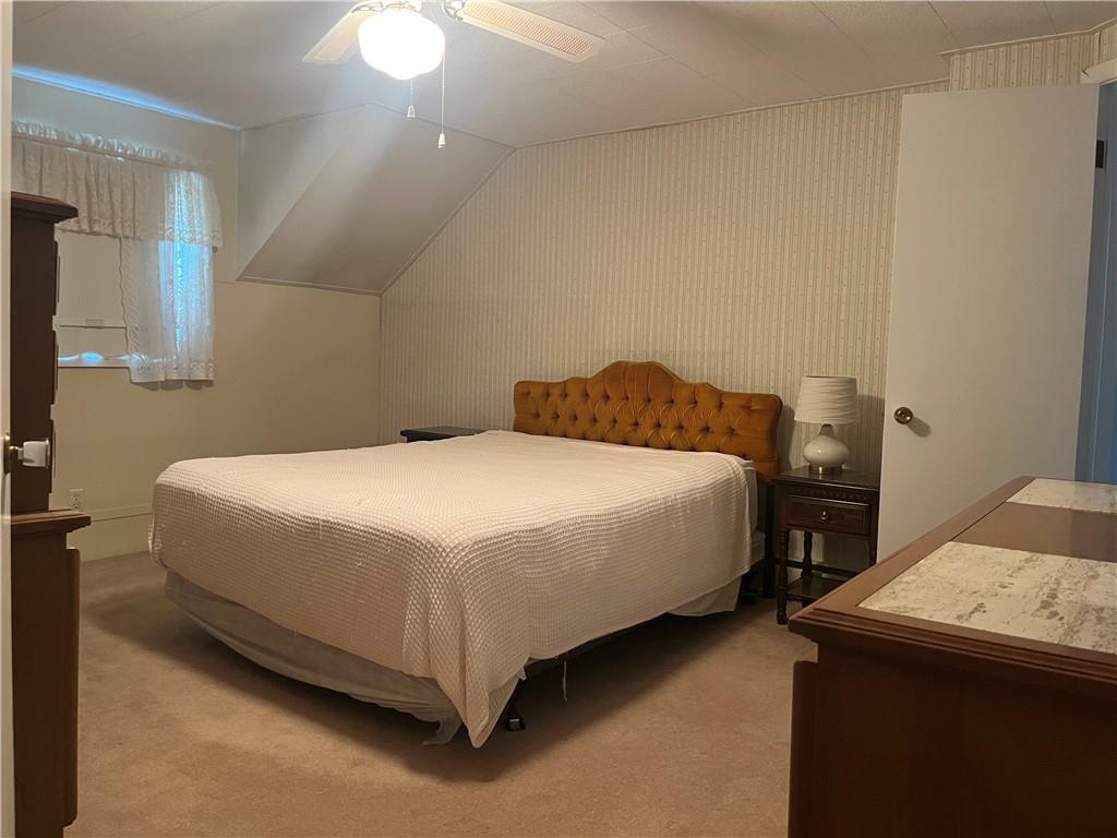 451-457 Joffre Cherry Valley Road Burgettstown, PA 15021 - Photo 29 of 46 a bedroom with a bed and a table in it