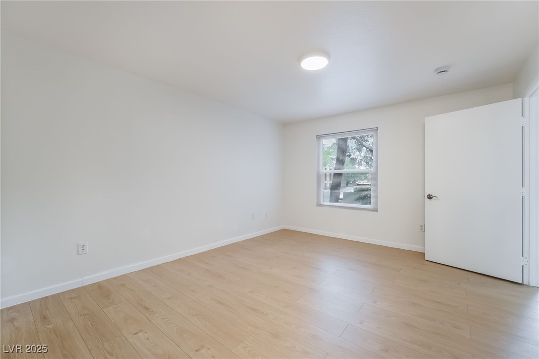 8101 West Flamingo Road, Unit 1090 Las Vegas, NV 89147 - Photo 17 of 30 Empty room featuring light wood finished floors