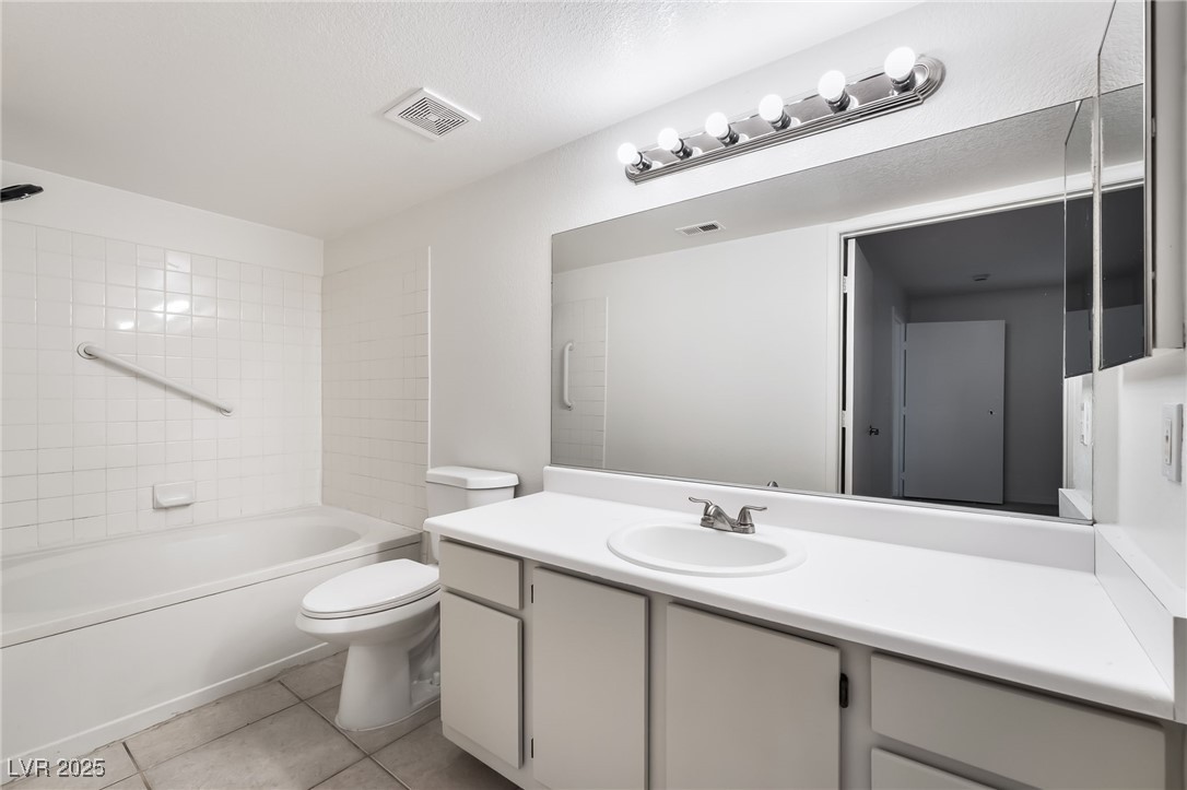 8101 West Flamingo Road, Unit 1090 Las Vegas, NV 89147 - Photo 18 of 30 Full bathroom with vanity, bathing tub / shower combination, and light tile patterned floors